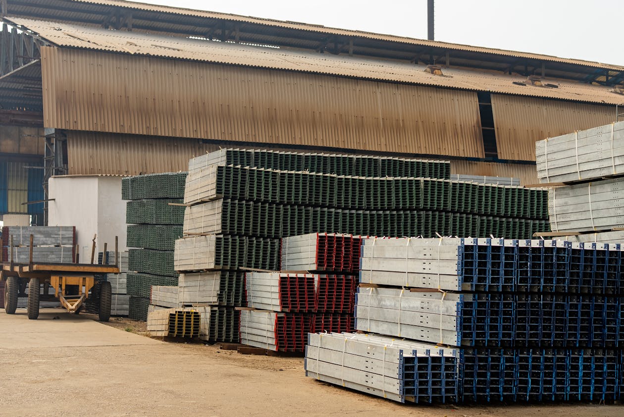 Stacked metal beams in an industrial warehouse